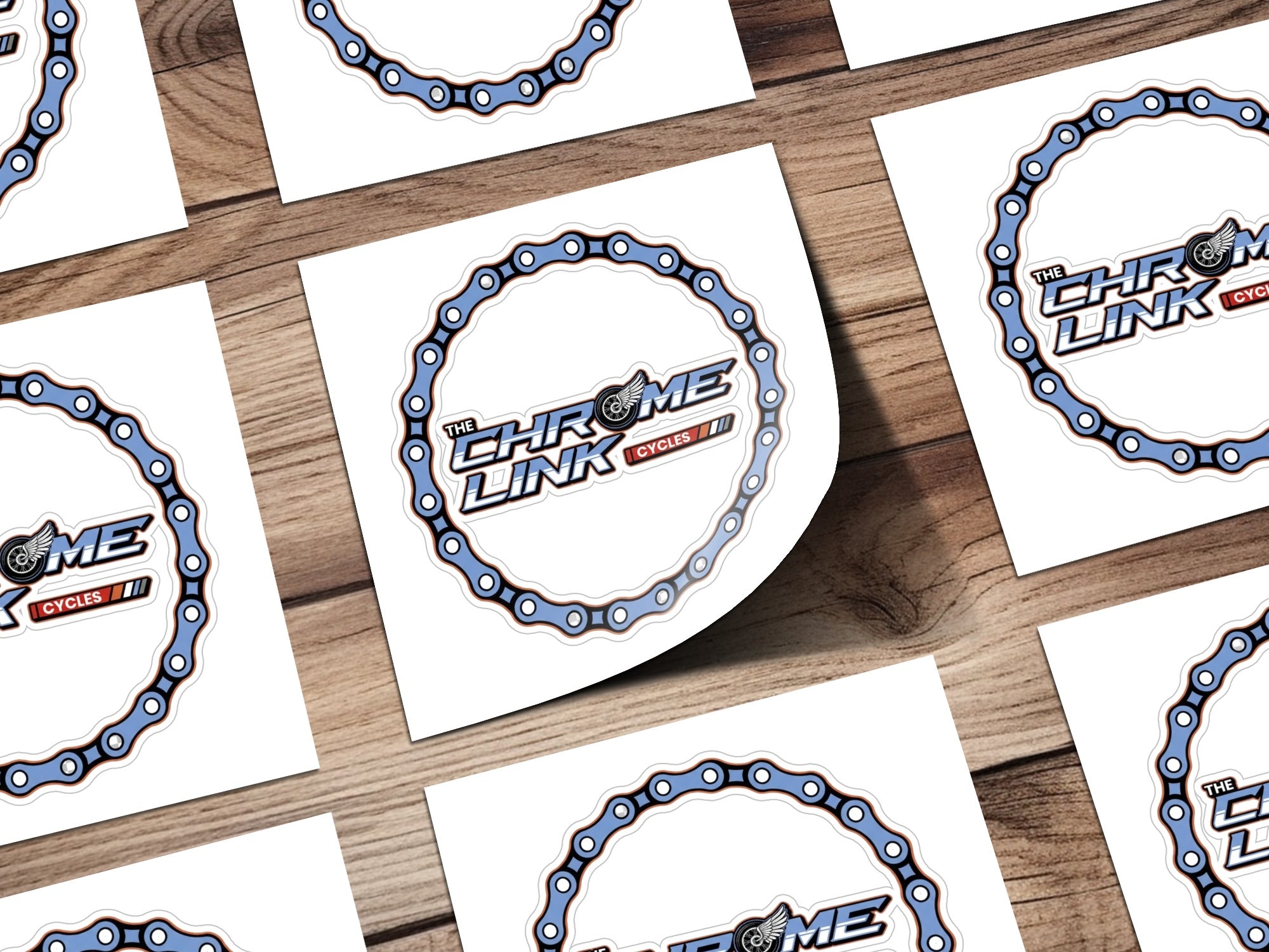Stickers with "The Chrome Link Cycles" logo, featuring a stylized bicycle chain.