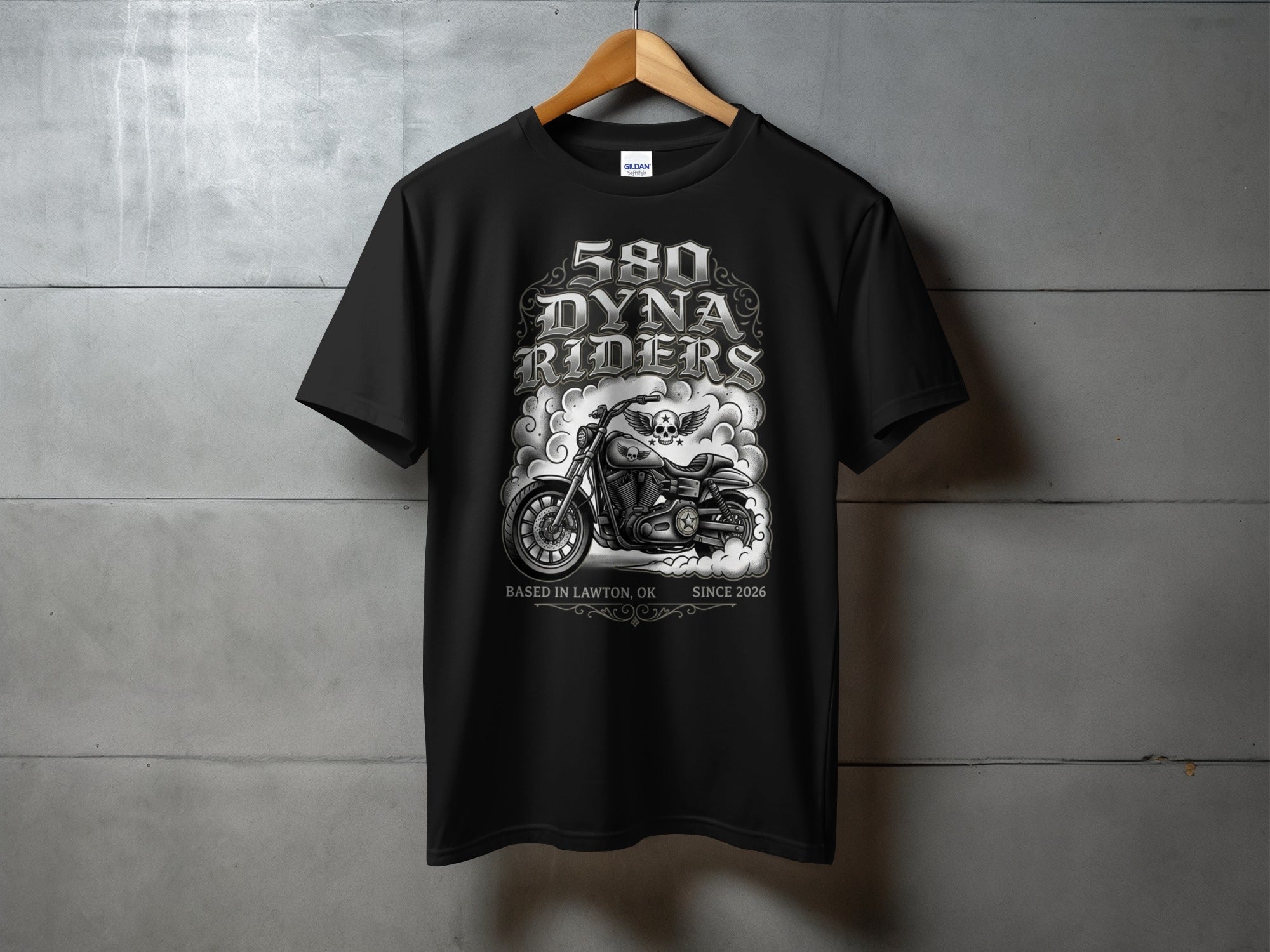 Black t-shirt with "580 DYNA RIDERS" graphic, motorcycle, skull, and text.